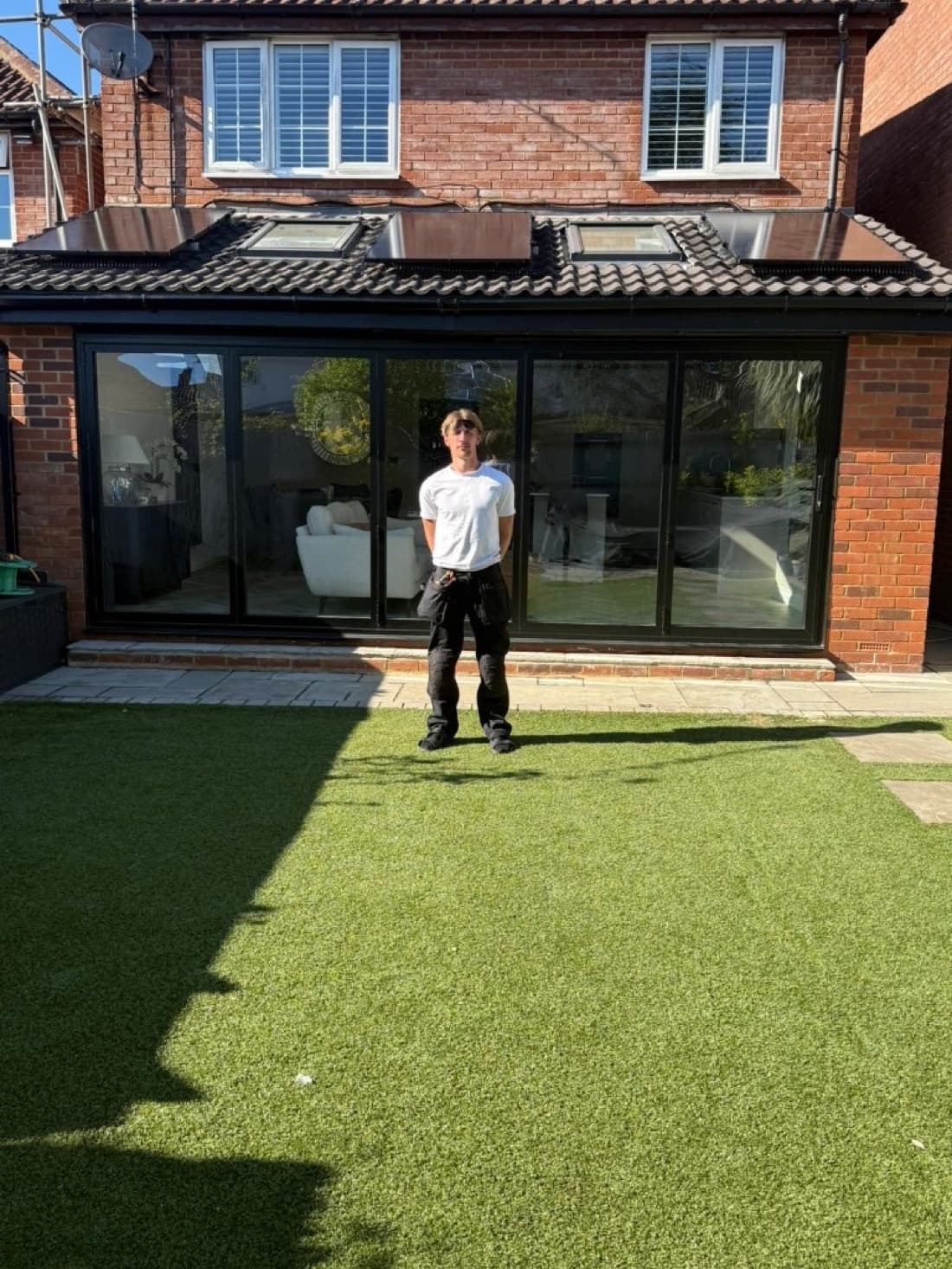 Jack, founder of Simply Solar Installers, standing in front of a completed solar installation