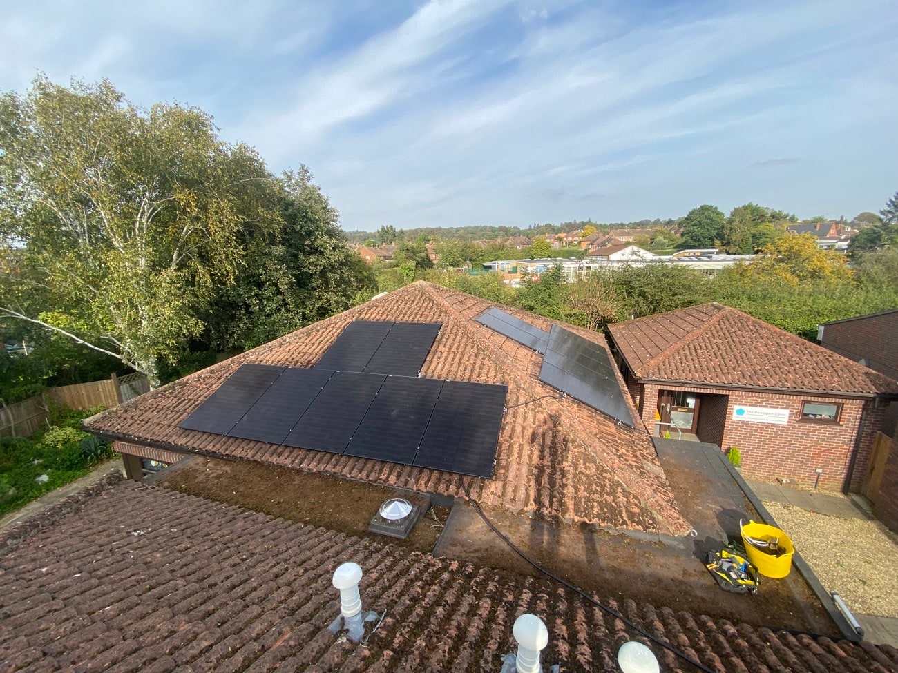 Aerial view of solar panels installed on a bungalow roof